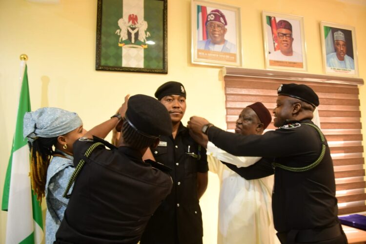 NASC Chairman Decorates Newly Promoted Ifeanyi Nwoye in charge of National Assembly Service Commission.